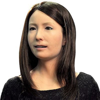 A female robot with a realistically human appearance of a young Japanese woman.