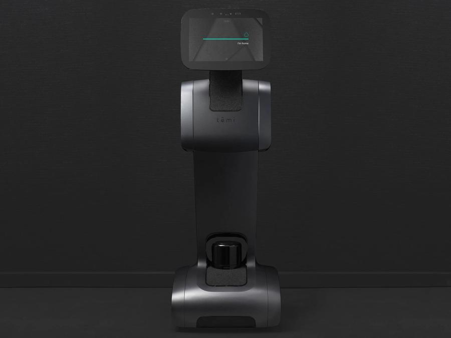 A black telepresence robot on a mobile base with a display on top.