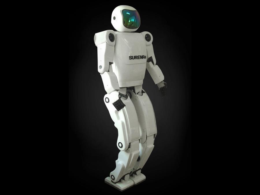 A white humanoid robot stands against a dark background.