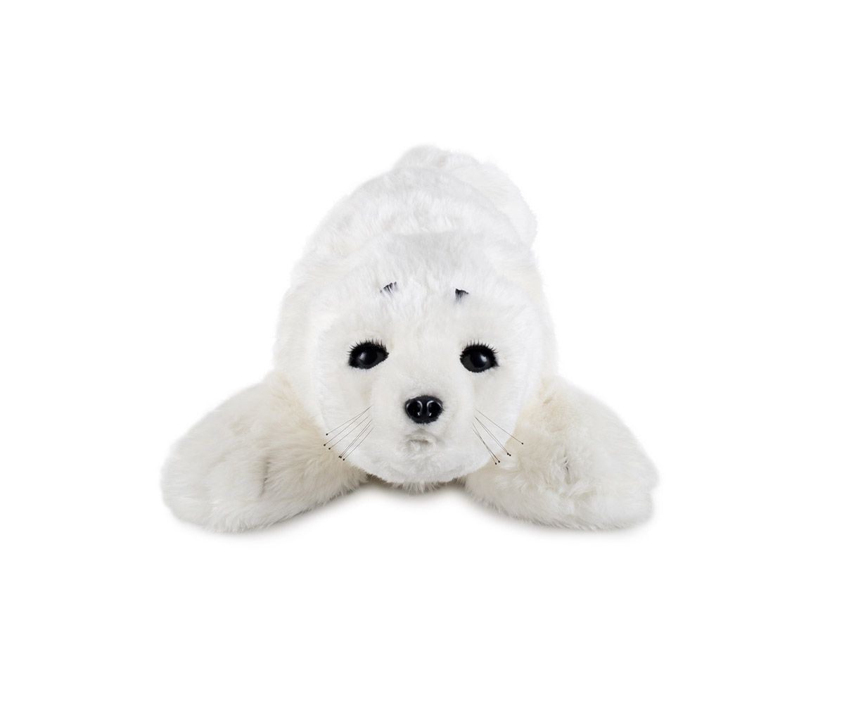 A spinning view of a furry white baby harp seal robot, which looks up at the camera and blinks and wiggles its tail.