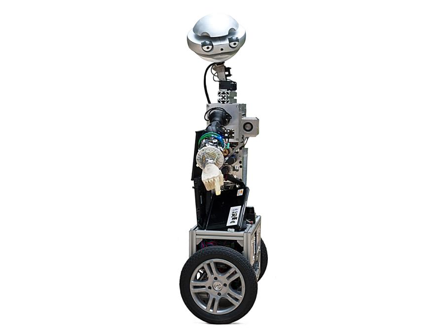 An expressive wheeled mobile robot points its finger downward.