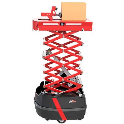 A wheeled black mobile base supports a red railed crane that is expanded upwards. At the top, a red base holds a brown package.