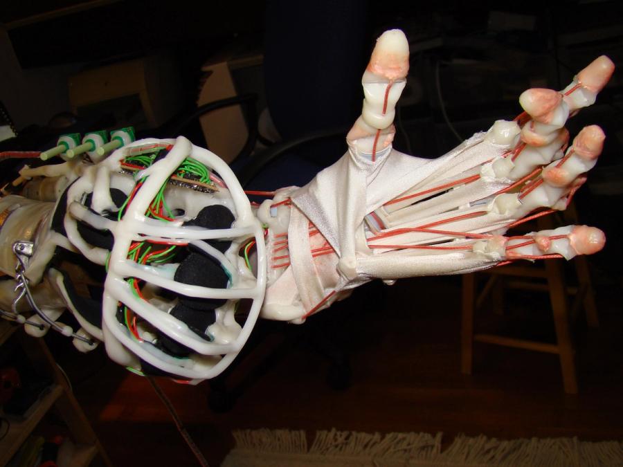 Close-up of the robot's five-fingered hand.