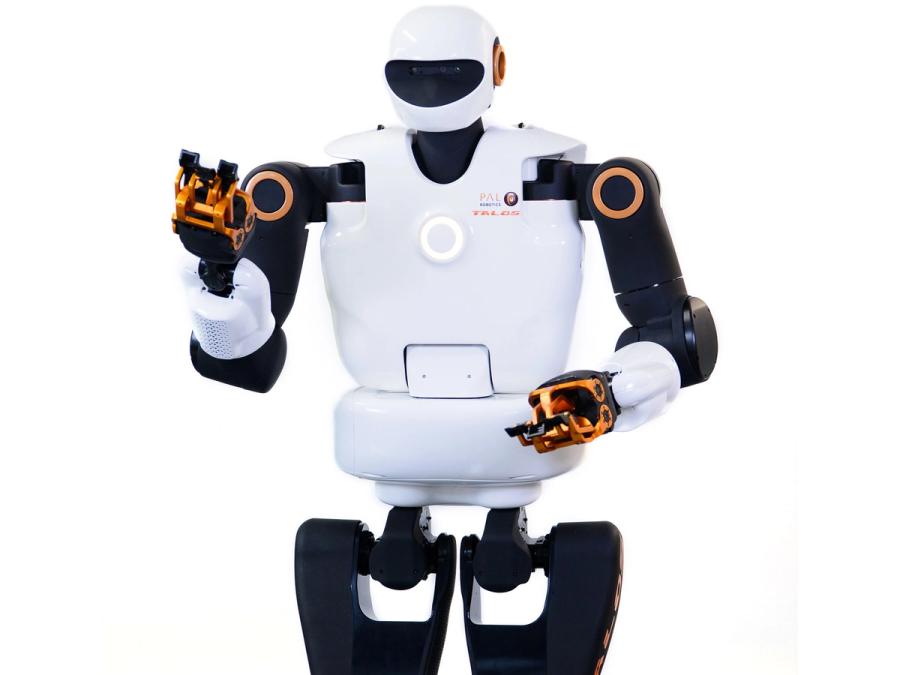 A humanoid with a shiny white torso, white and black helmeted head, and two jointed arms with copper colored gripper hands. It has two wide black legs.