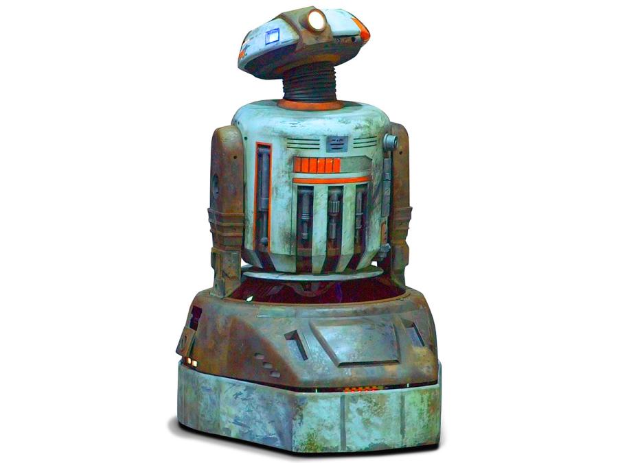 A robot with a beat up looking metallic base and torso, two arms, a neck and a head shaped like the top of circle.